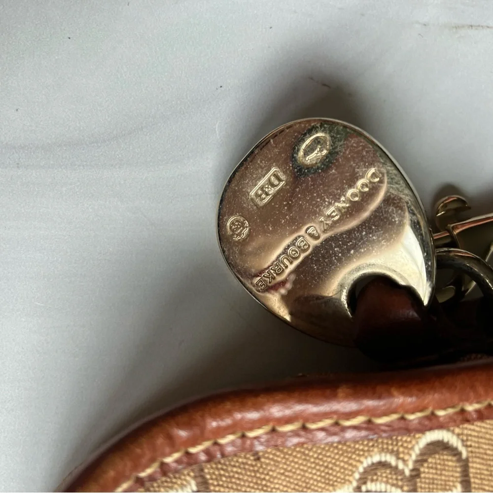 Dooney and Bourke signature logo tan leather and‎ brown monogram fabric wristlet